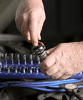 Person using 100 Tooth Swivel Head Ratchet Set for heavy duty jobs with chrome vanadium steel drive.