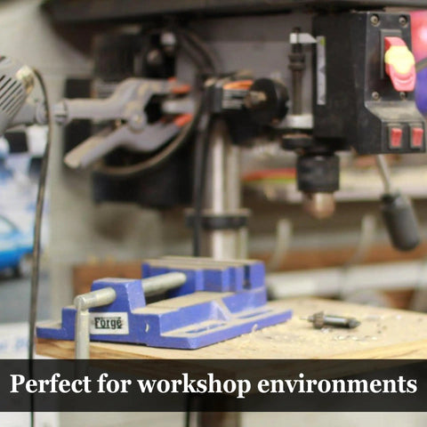 Workshop with tools, drill press and vise visible in foreground, indicating potential use for Eco Friendly Multipurpose Lubricant Spray.