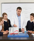 Teacher demonstrating Portable Wind Tunnel Lab Kit For Wing Lift Experiments Hands On Aircraft Aerodynamics Model in classroom.