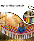 Girl sitting on colorful hammock with fringe, featuring an easy-to-disassemble design and close-up of spreader bars in forest setting.