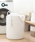 White Laundry Basket With Handles, Tall Woven Hamper For Clothes And Towels, 16x20 Inches, next to washing machine