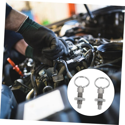 Heavy Duty Stainless Steel Indexing Plungers For Machine Tools Rock Solid Spring Loaded Mounting Bolts being used on a vehicle engine.