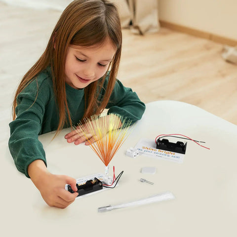 Child using 12 Kid Friendly Fiber Optic Light Kit Sets for Hands On STEM Activities and Simple Electric Circuits at home.