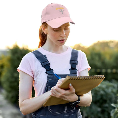 Woman outdoors wearing Im Just His Apprentice Pink Adjustable Cap For Men Dope Hat With Custom Fit For Running Hiking Cycling And Everyday Wear