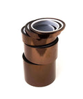Stack of Kapton Polyimide Low Static Adhesive Tape, Three Inch Core, One Mil Thick, Thirty Six Yard Length, Half Inch Width