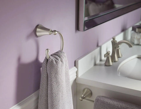 Wynford 24 Inch Single Towel Bar In Brushed Nickel Finish For Bathrooms And Kitchens, Flexible Mounting, shown with towel in bathroom close-up.