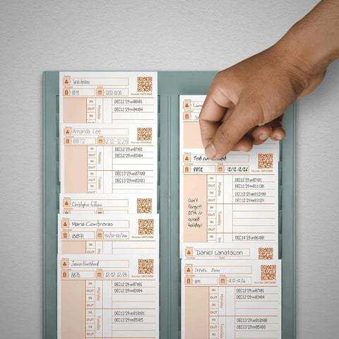 Hand reaching for a Heavy Duty Replacement Time Card CR1000 from a holder, featuring employee shift information and QR codes.