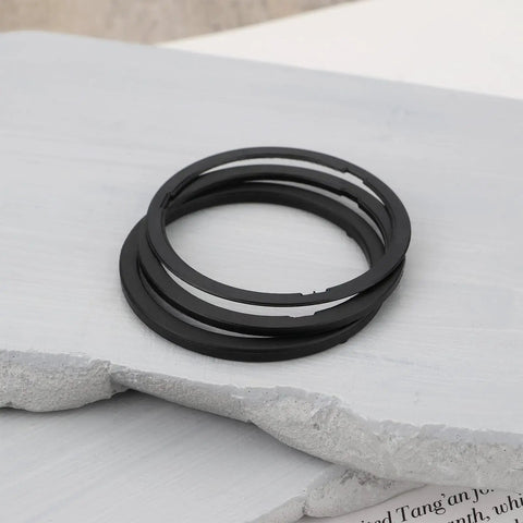 16 Piece Mountain Bike Bottom Bracket Spacer Kit With 35x41mm Washers For Shimano BB51 BB52 BB70 shown on a stone surface