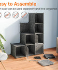 Multipurpose Portable Cube Storage Organizer 14 Inch By 14 Inch Black 4 By 3 Cube Cubbies in a living room setting