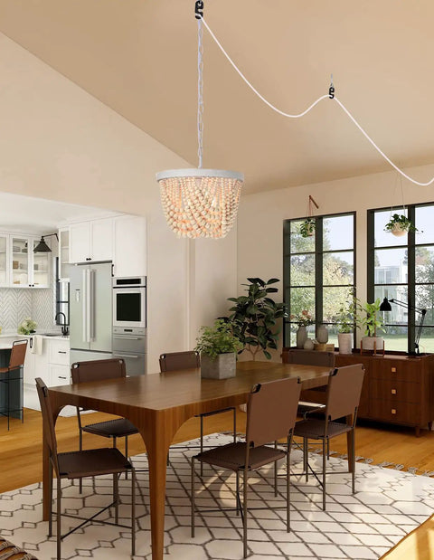 Plug In Wood Beaded Chandelier With 20 Foot Hanging Cord 3 Light Boho Farmhouse Ceiling Fixture For Bedrooms Rustic White Metal Finish Pendant Light Home Decor hanging over dining table in modern room.