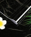 Rolled marble contact paper on black background with flower and leaves, Marble Contact Paper Self Adhesive Waterproof PVC White Kitchen Countertop