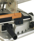 Premium Benchtop Chop And Miter Saw Cuts Like Thunder Through Wood Plastics And Aluminum Featuring Smooth 45 Degree Rotating Base; close-up of blade and wood piece.