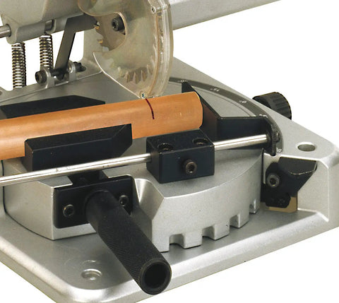 Premium Benchtop Chop And Miter Saw Cuts Like Thunder Through Wood Plastics And Aluminum Featuring Smooth 45 Degree Rotating Base; close-up of blade and wood piece.