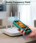3 In 1 EMF Detector For EF MF And RF And WiFi Radiation Readings next to WiFi router, handheld showing digital display