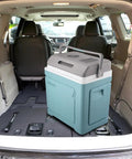 Massive 30L Electric Travel Cooler For Cars And Rvs in vehicle trunk with gray lid and teal body for portable use.
