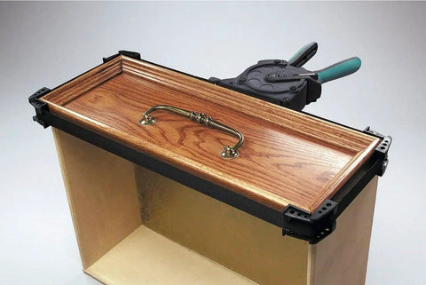 One-Hand Ratcheting Band Clamp For Quick Glue-Ups And Framing, 16-Inch Clamp With Self-Adjusting Corners on wooden box