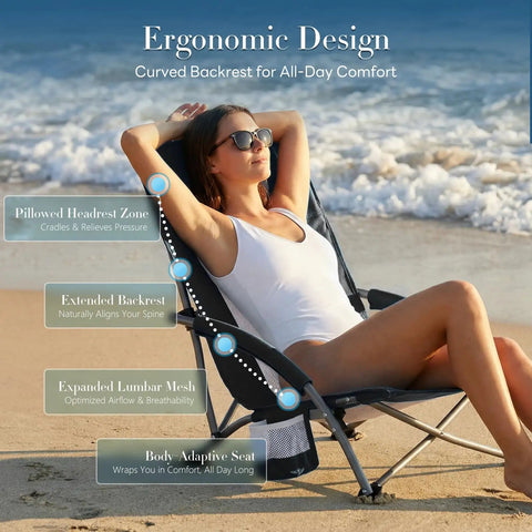 Woman relaxing on Low Profile Camping Beach Chair With Cup Holder, Storage Pocket, Breeze Mesh Back, Padded Armrests on beach.