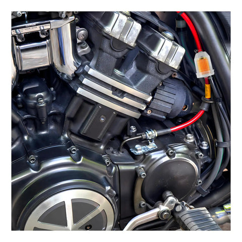 Close-up of motorcycle engine with Universal Go To Gas Inline Fuel Filter With Magnet for One Quarter Inch and Five Sixteenth Inch Fuel Lines