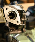 Close-up of self-locking threaded insert kit in use for repair, highlighting heavy-duty fasteners for metal with coarse threads.