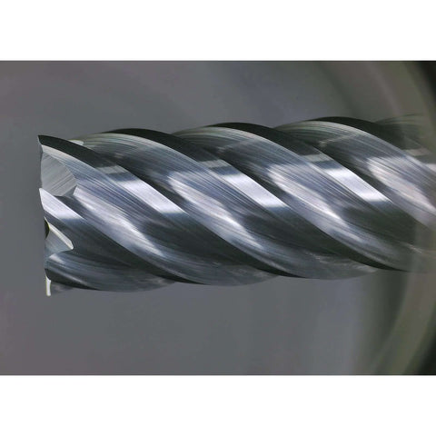 Carbide end mill with 6 flutes and 1/4 in shank, close-up of helical cutting edges