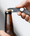 Ultra Slim Stainless Steel Multi Tool V2 With Titanium Coating Pocket EDC Gear used to open bottle