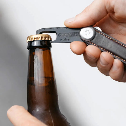 Ultra Slim Stainless Steel Multi Tool V2 With Titanium Coating Pocket EDC Gear used to open bottle