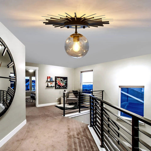 Sleek Black Flush Mount Ceiling Light With Glass Globe Sputnik Starburst in modern hallway setting