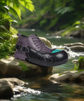 Industrial Steel Toe Overshoes Providing Badass Rock Solid Protection Heavy Duty Anti Slip Rubber Covers shown on rock near water.