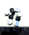 Image of One Half Inch Round Silicone Rubber Bumper Feet Three Sixteenths Of An Inch Thick Adhesive Backed Spacer Pads next to a ruler