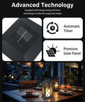 Solar Outdoor Lanterns Waterproof 14 Inch Two Pack With LED Flickering Flameless Candles on table at night