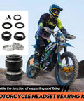 Motorcycle headset bearing kit with tapered roller bearings beside Light Bee X S Sur Ron electric dirt bike