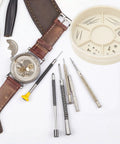 Watch repair tools and components with round tray holder and colorful 5 layer watch parts storage box organizer for movement screws.