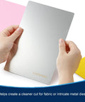 Hands holding 6x9 Inch Metal Cutting Plate For Die Cutting Accessories, 304 Stainless Steel, Thin Yet Tough, Durable Silver Plate