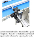 Close-up of guardrail adjustment knob on Ready To Go Automatic Desktop Conveyor Round Bottle Labeler with stainless steel body.