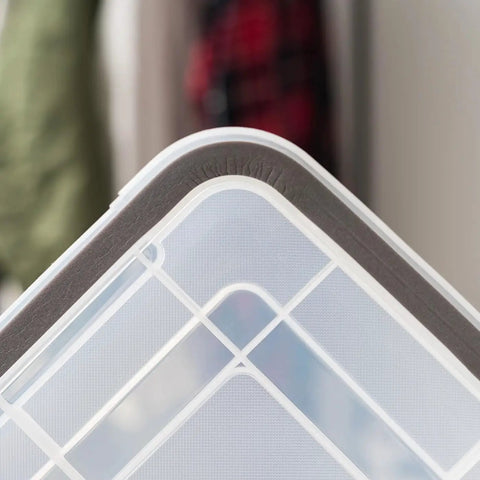 Close-up of Heavy Duty 62 Quart Storage Tote With Secure Seal Lid showing secure lid and latches for camping gear.