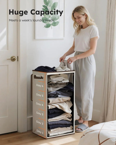 Woman using Big Ol 100L Large Laundry Basket With Removable Bag And Lid, demonstrating its capacity, off white, bedroom setting.