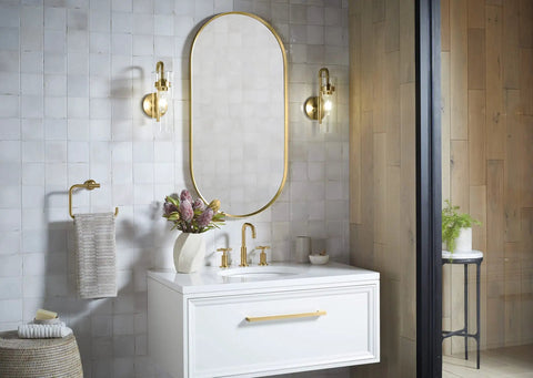Bathroom with Purist 1 Light Sconce With Rounded Glass Shade And Tubular Metal Base, mirror, and white vanity.