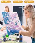Woman using 14 Colors Acrylic Pour Paint Kit With Premixed High Flow Paints 8.45oz Each Bulk Set Includes Canvases Wood Slices Pouring