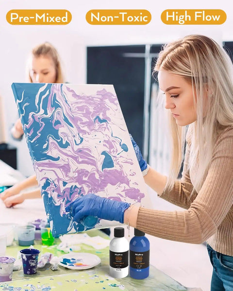 Woman using 14 Colors Acrylic Pour Paint Kit With Premixed High Flow Paints 8.45oz Each Bulk Set Includes Canvases Wood Slices Pouring