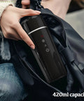 Road Warrior 420ml Portable Water Heater And 12V 24V Travel Kettle Straight Up Reliable For Car Camping, held in hand.