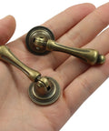 Antique Brass Door Handle Set 2.44 By 0.94 Inches Ten Pack With Tear-Drop Knobs Solid Zinc Construction Vintage Bronze Finish in hand