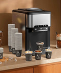 4 Oz Disposable Paper Espresso Cups 500 Pack Small Coffee Cups For Hot Or Cold Drinks Ideal For Espresso Cappuccino Parties Picnics Home Office And Business Black displayed beside a coffee machine.