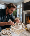 3D Marble Run Puzzle Kit For Adults, Wooden Engineering Project, DIY Mecha Style Build, Interlocking Blocks, Brain Teaser Craft To Assemble, Requires 2 AA Batteries Not Included, Premium Wood Construction, man assembling wooden gears on table