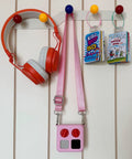Card Organizer For Yoto Cards With 200 Self Adhesive Tabs And 10 Colorful Stainless Steel Loops on peg hooks with headphones and Yoto cards.