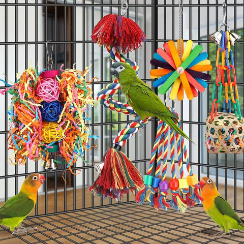 Colorful All In One Bird Toy Set with rope perch, bell, and foraging chewing shredding toys, in a bird cage with parrots, conures.