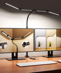 Ultra Wide 31.5 Inch Desk Lamp With Clamp 24W 1800LM Auto Dimming on a desk between two monitors showing lamp angle adjustments.