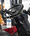 Out Of Service Notice Tags Kit With 30 White 5.5 By 3 Inch Signs In 32 Mil Vinyl Material On Forklift Handle In Warehouse