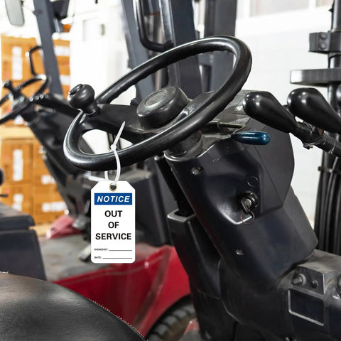 Out Of Service Notice Tags Kit With 30 White 5.5 By 3 Inch Signs In 32 Mil Vinyl Material On Forklift Handle In Warehouse