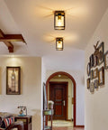 Flush Mount Ceiling Light Fixture With Clear Glass Shade In A Farmhouse Black Metal Frame installed in hallway ceiling