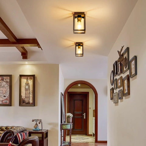 Flush Mount Ceiling Light Fixture With Clear Glass Shade In A Farmhouse Black Metal Frame installed in hallway ceiling